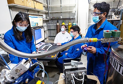 Graduate students working in laboratory