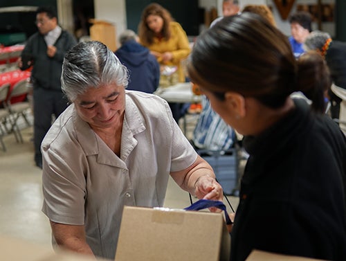 Senior at food bank Senior at food bank