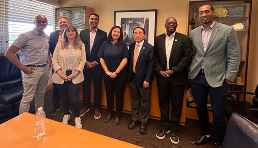 UCR Chancellor S. Jack Hu with Cisco officials 