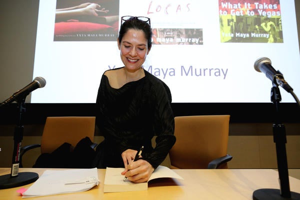 Novelist Yxta Maya Murray signs her book during the 42nd Annual Writers Week  on Monday, Feb. 11, 2019 at UCR.  (UCR/Stan Lim)
