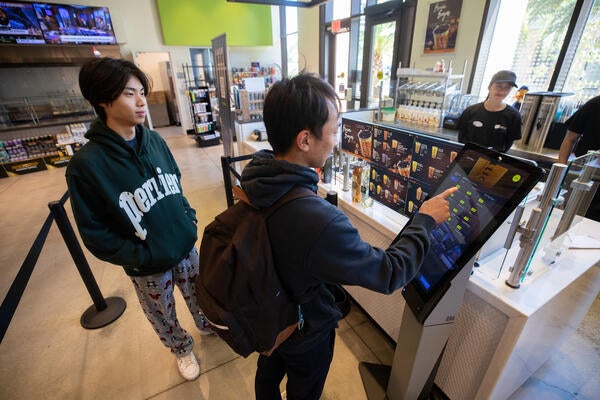 Dustin Huang and Colin Sheng ordering boba.