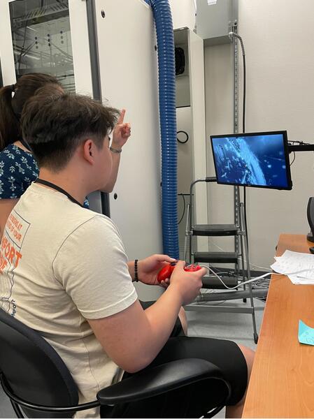 Students use game controllers