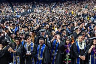 Students in caps and gowns at commencement