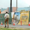 student walking past construction site