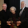 Novelist Margaret Atwood receives an award with Tom Lutz,  professor of creative writing and director of Writers Week , left, and Chancellor Kim Wilcox, at the start of the 42nd Annual Writers Week Conference on Monday, Feb. 4, 2019, at UCR. (UCR/Stan Lim)