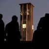 UCR belltower with silhouettes in the foreground