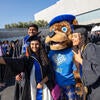 Graduates taking selfie with Scotty Bear