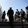 Graduates walking up stairs