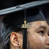 Graduate wearing cap with Class of 2023 tassel