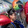 Graduate with balloons