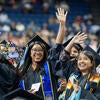 Graduates waving to crowd