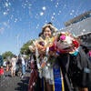 Graduate surrounded by bubbles