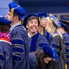 Graduate playfully sticking tongue out at crowd
