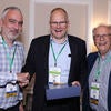 Koch, center, with co-directors of the  Hydrogen Engine Alliance of North America, UCR's Georgios Karavalakis, left, and  André Boehman, right, of a University of Michigan.