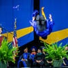 BCOE graduate backflipping on stage