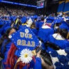 CHASS graduates wearing decorated caps