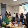 Faculty, staff, and students assemble emergency evacuation kits at the symposium.