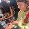Young fairgoer holding live insect