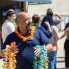 handing out leis