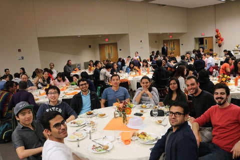Students share a meal during the International Affairs Thanksgiving event 2018.