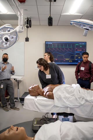 Community college students visit a medical school lab.