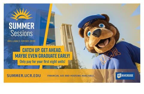 Scotty Bear standing in front of UCR Bell Tower.