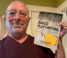 Robin Russin is pictured holding “Naked Playwriting: The Art, the Craft, and the Life Laid Bare,” a revised second edition published in January 2023. The first edition was published in 2005; this edition includes all the critical elements needed to write a play: concept, character, dialogue, and story. (UCR/Photo courtesy of Robin Uriel Russin)