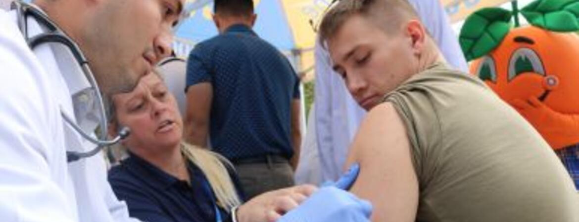Physician administers flu vaccine