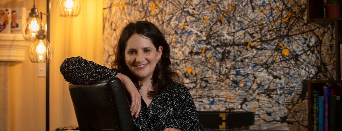 Dana E. Kaufman, assistant professor for UC Riverside’s Department of Music, in her home on March 30, 2021, in Riverside. (UCR/Stan Lim)