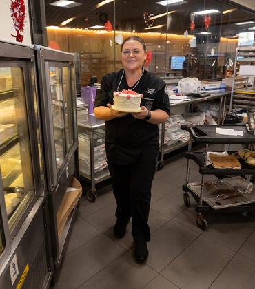 Allison Eagan holding a cake