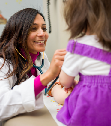 Pediatrician with patient