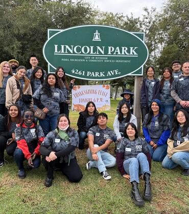 UCR students posing for a photo at Lincoln Park after community service event