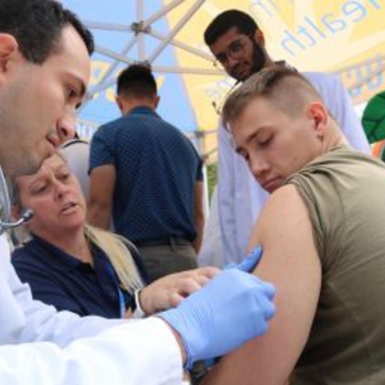 Physician administers flu vaccine