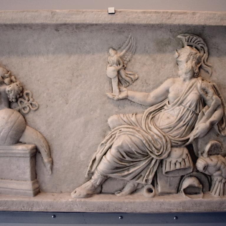 Defaced Dea Roma holding Victory and regarding an altar with a cornucopia and other offerings, copy of a relief panel from an altar or statue base