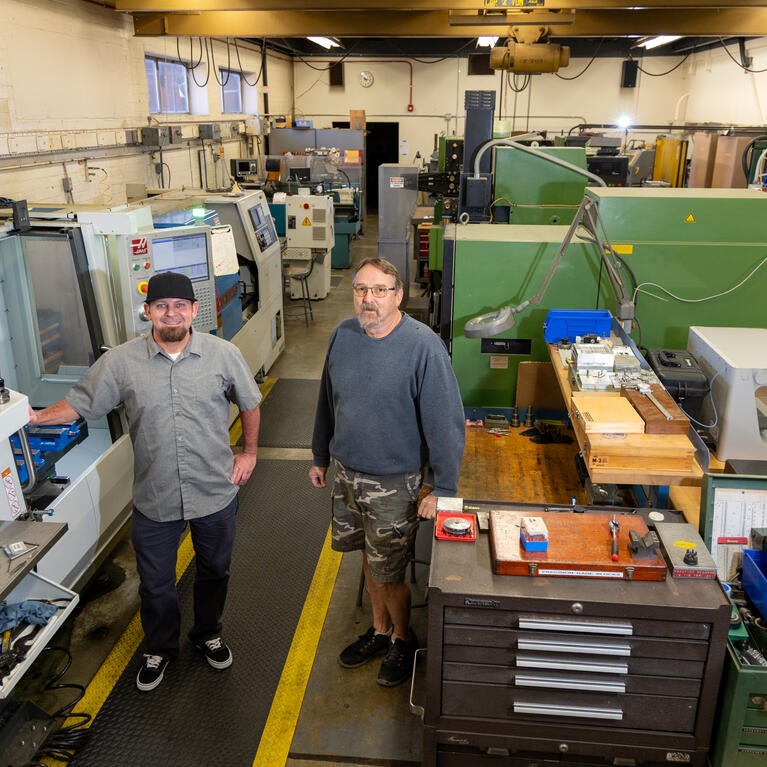 Eric Gazelle and Jay Lefler in CNAS machine and glass shop