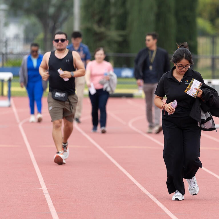 Runners and walkers at track