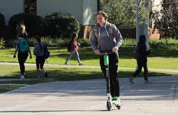 Student on scooter