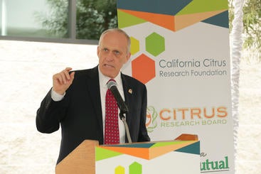 UC Riverside chancellor Kim Wilcox speaking at the ribbon-cutting ceremony for a biosafety level 3 citrus research lab