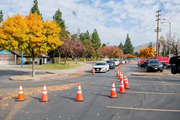 Cars line up at drive-thru site