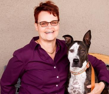 Katja M. Guenther with her dog, Monkey