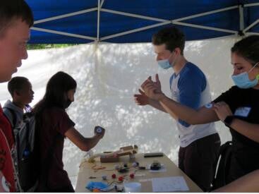 David Nikom and Courtney Scaramella with students