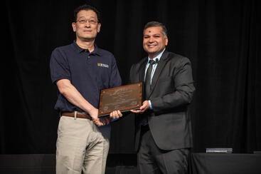 Albert Wang with IEEE EDS President Ravi Todi, receiving the 2022 J.J. Ebers Award from IEEE Electron Devices Society. (Courtesy Photo/Albert Wang)