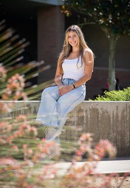 Camila Acosta in front of CHASS building