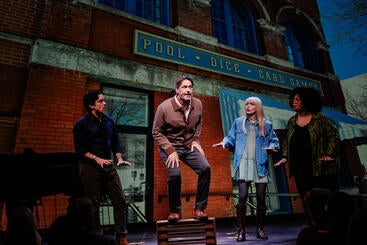 A photo of actors performing a song in the stage production "I Hear America Singing" at the Peoria Riverfront Museum in Illinois.