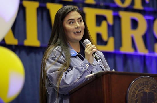 Student speaker Fernanda Ambrosio speaks during the College Signing Day 2019 celebration at UC Riverside on Wednesday, May 1, 2019.(UCR/Stan Lim)