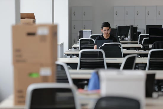 student researcher at desk