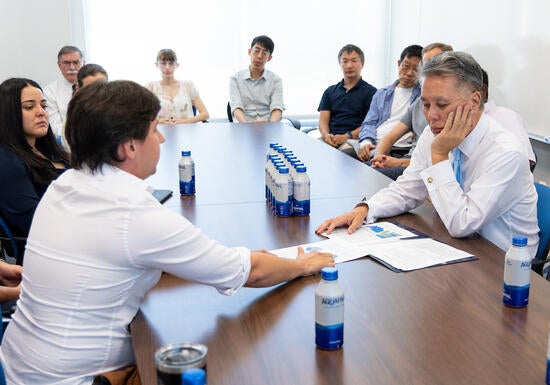 Shawn Westerdale discusses with Mark Takano some of the needs of the Experimental Cosmology Center