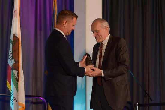 Chancellor Wilcox getting an award