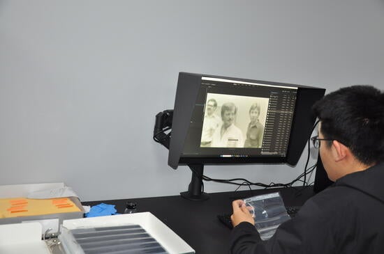 student compares film to digitized files