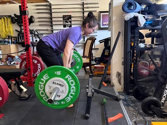 Rachel Wu lifts weights